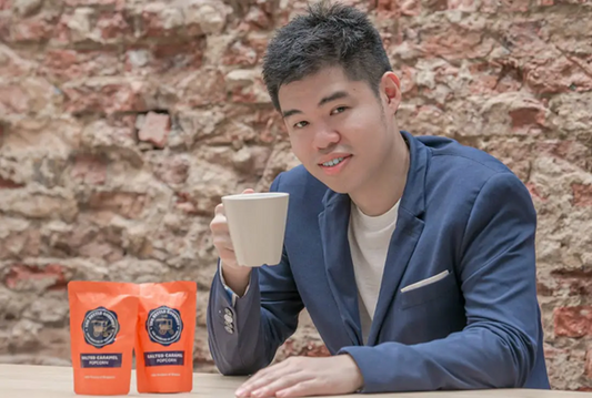 Our founder, Zac, posing with our Salted Caramel in the old packaging